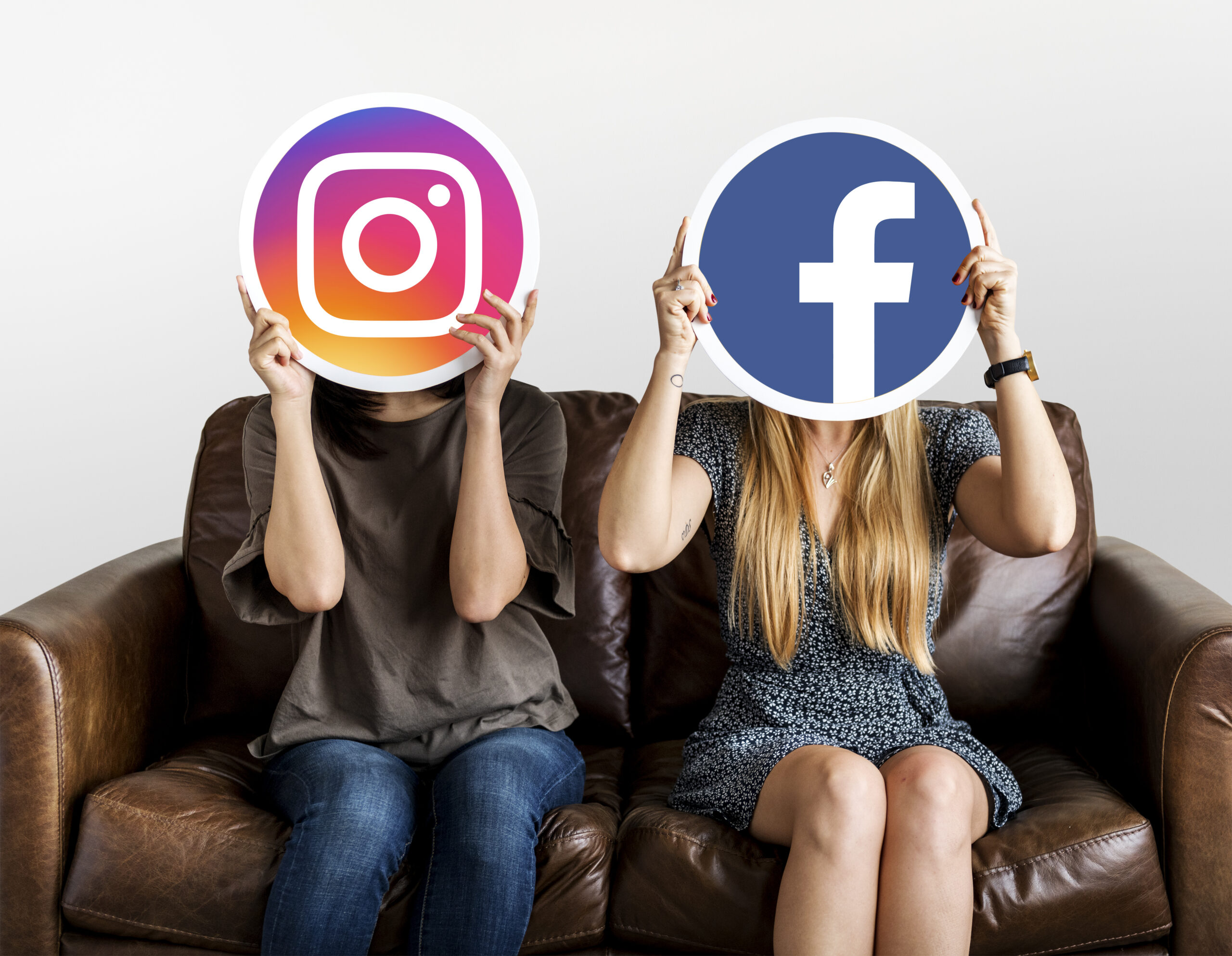 People holding social media icons